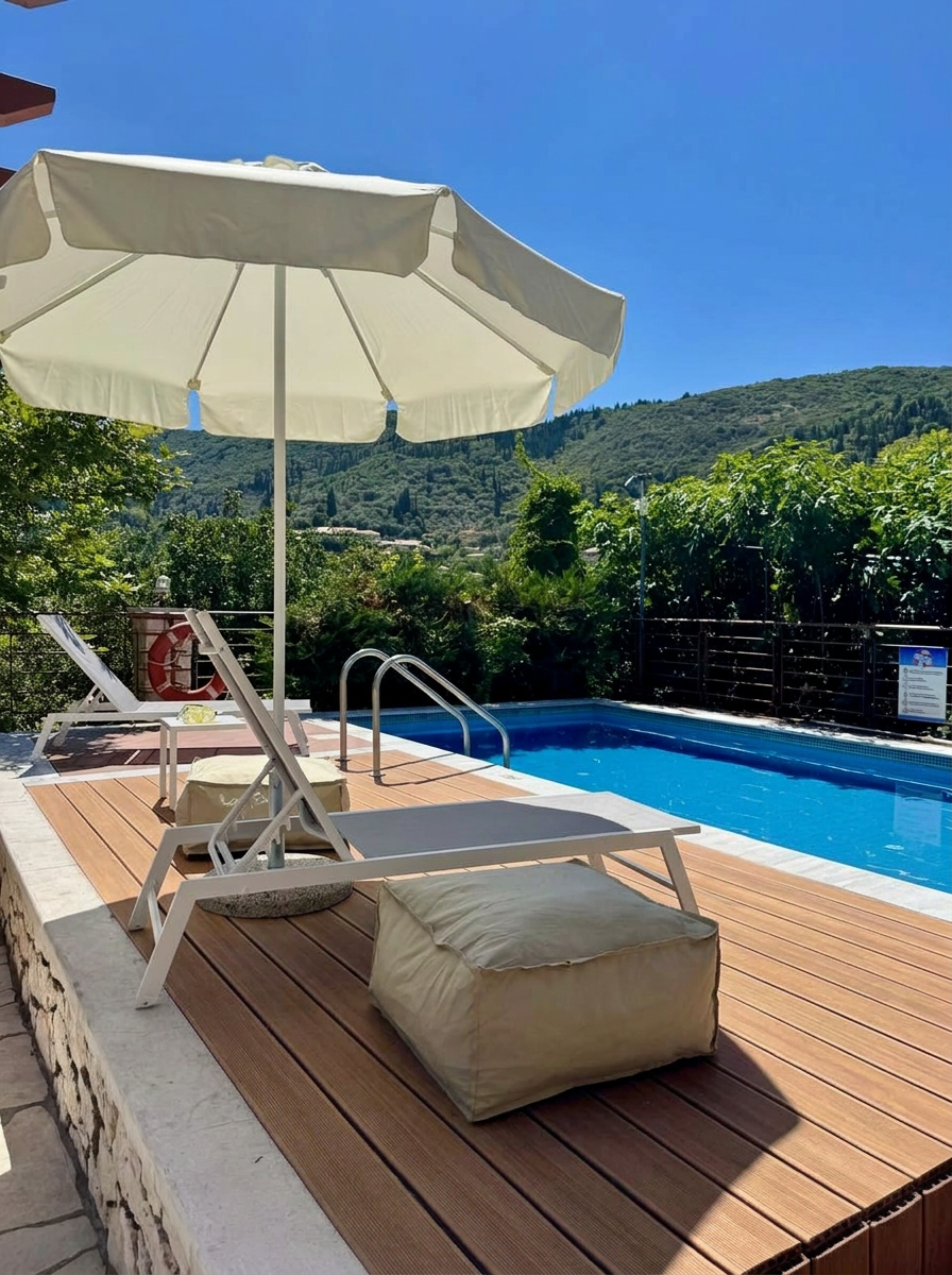 Pool deck with umbrella and loungers